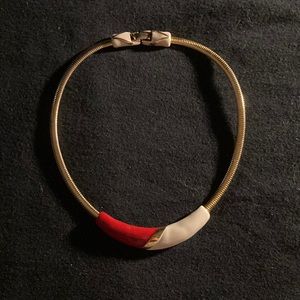 Z169- Costume jewelry- Gold colored necklace with a red and cream colored design